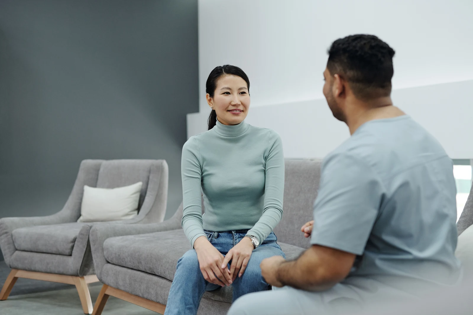 Woman in conversation with a doctor during an appointment about perimenopause symptoms